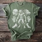 Green t-shirt with werewolf anatomy print including skull, hands, and feet.