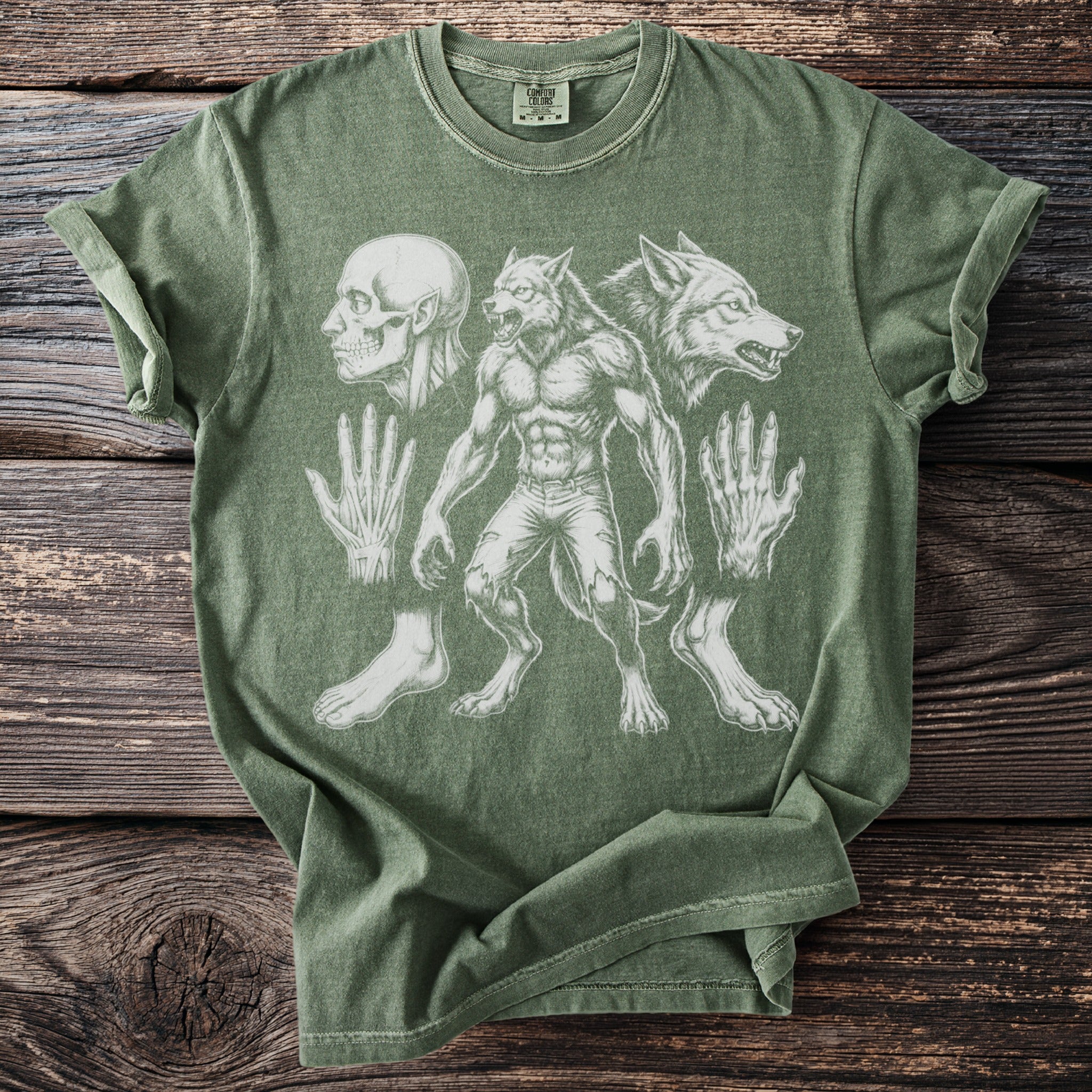 Green t-shirt with werewolf anatomy print including skull, hands, and feet.