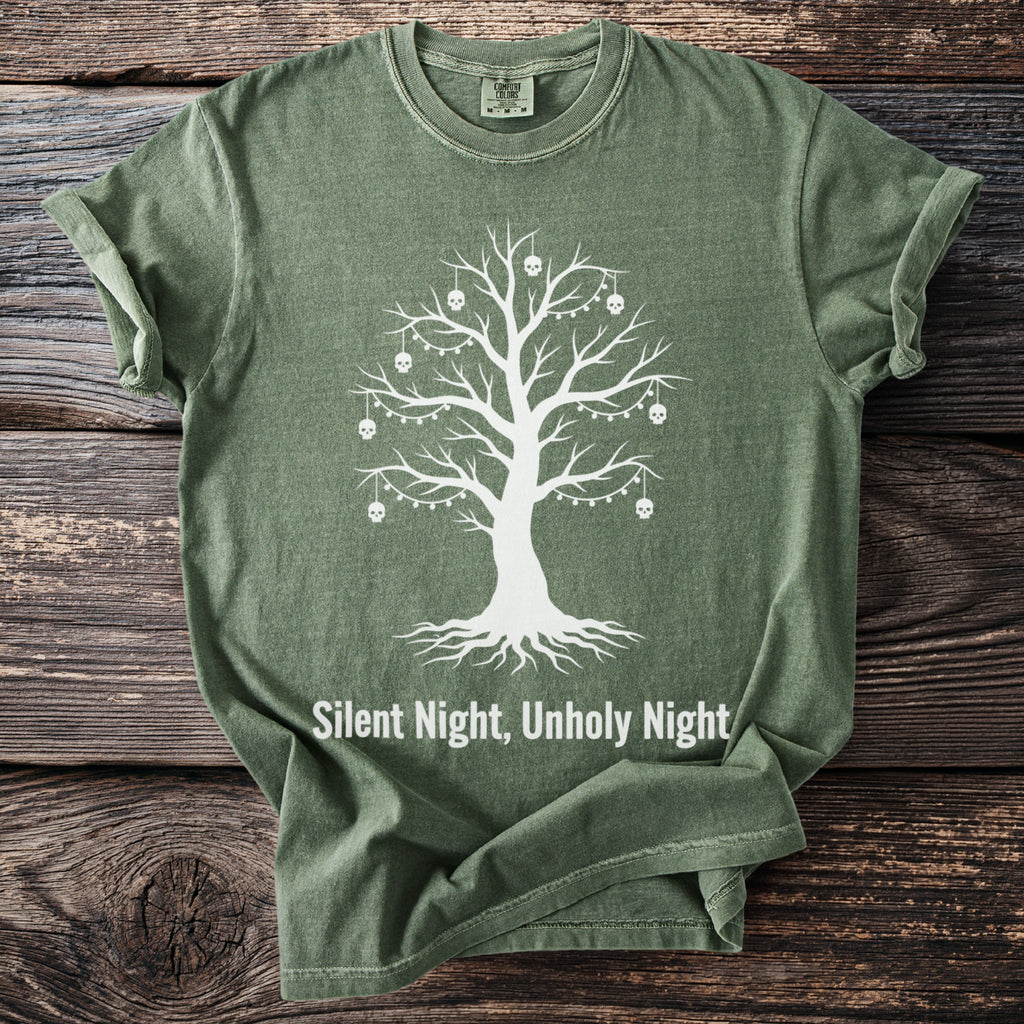 Green t-shirt with white tree graphic adorned with skulls and lights, reading "Silent Night, Unholy Night".