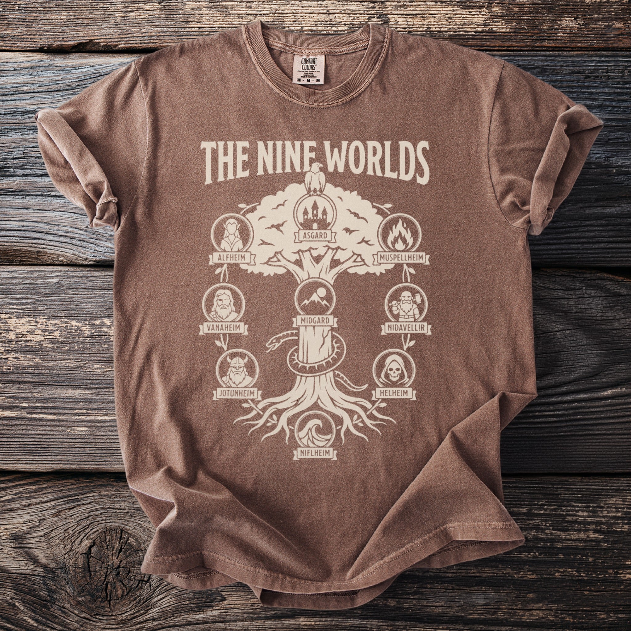 Brown t-shirt with "The Nine Worlds" Norse mythology tree graphic and labels.