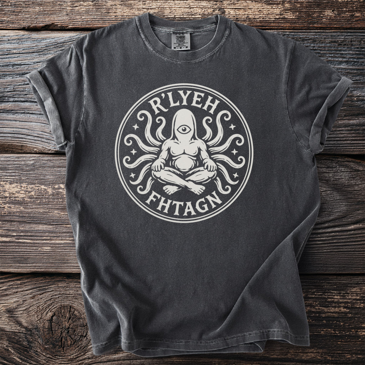 Dark gray t-shirt with white R'LYEH FHTAGN graphic of seated figure with tentacles.