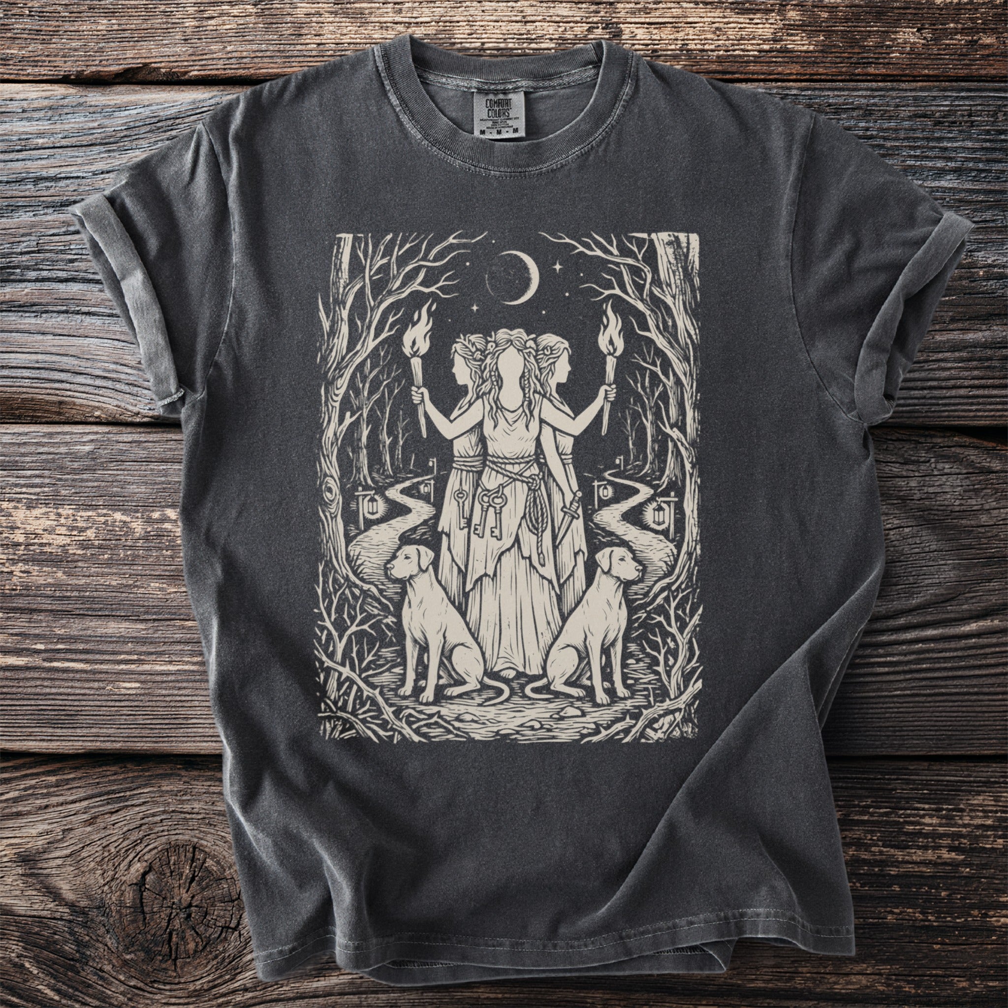 Dark grey t-shirt with a print of three figures holding torches, a crescent moon, and two dogs.