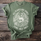 Green t-shirt with skull and plants graphic and text "All Plants Are Edible Some Only Once".