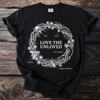 Black t-shirt with circular "Love the Unloved" design featuring insects and sea lamprey.