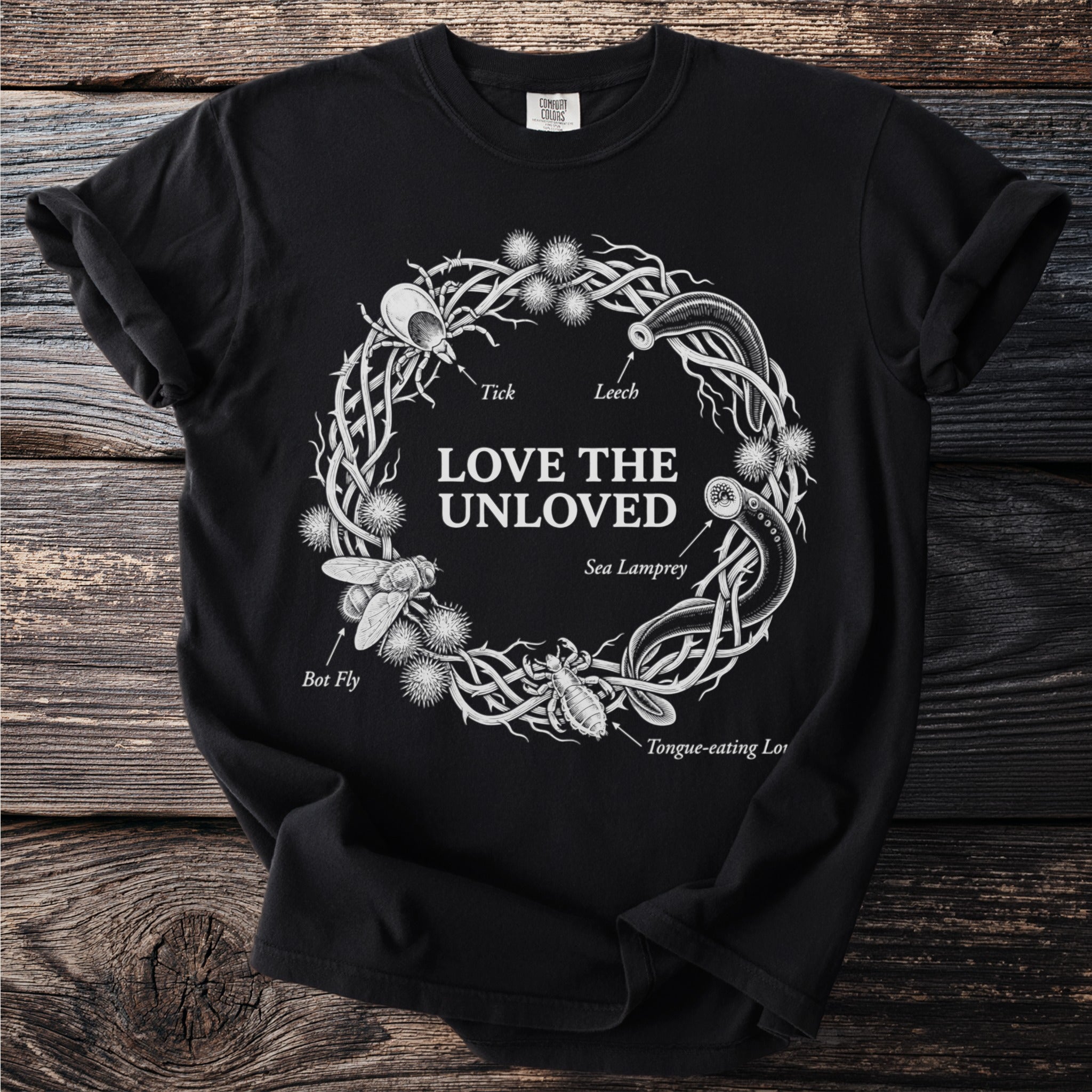 Black t-shirt with circular "Love the Unloved" design featuring insects and sea lamprey.