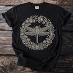 Black t-shirt with detailed cream dragonfly and floral wreath design.