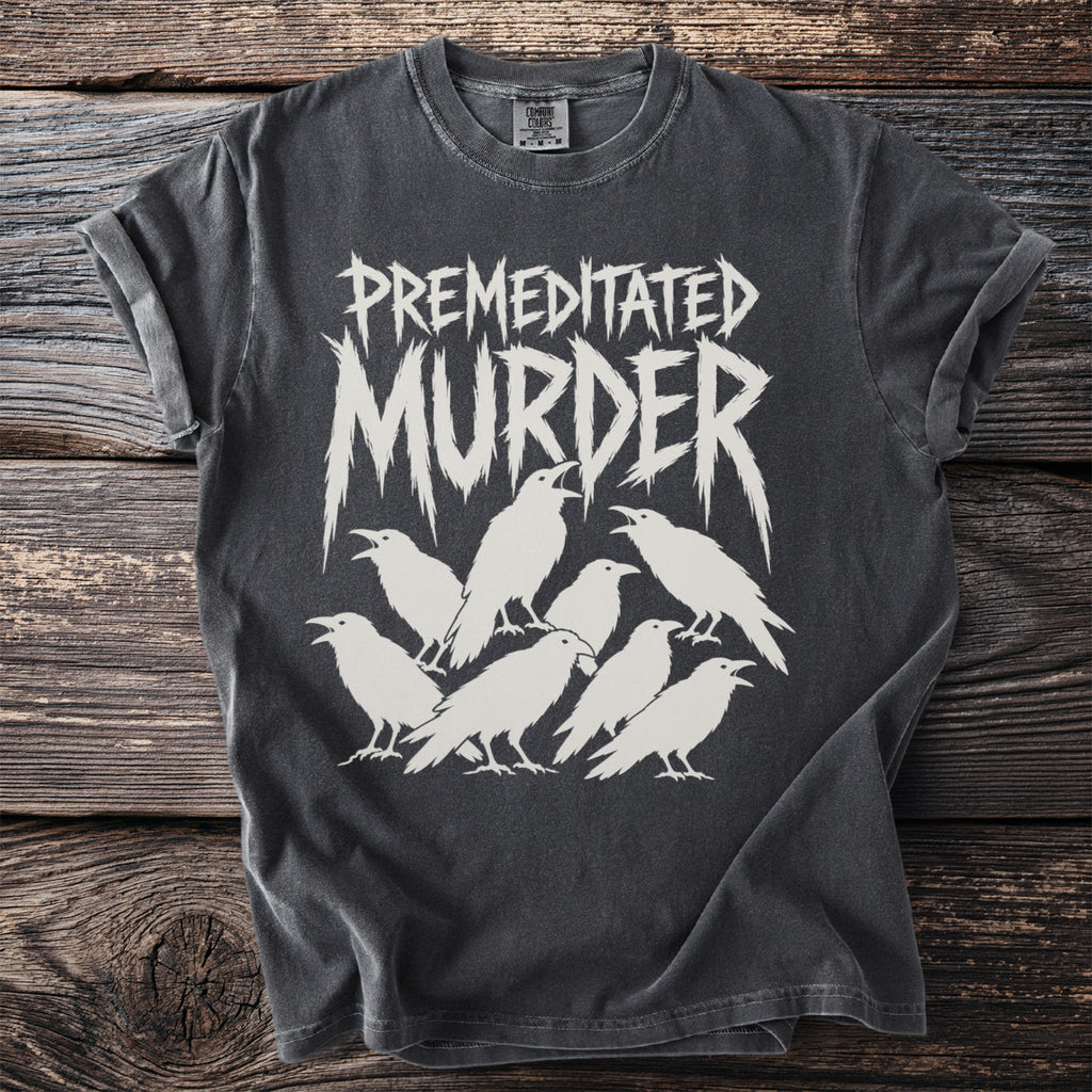 Dark t-shirt with white graphic of "PREMEDITATED MURDER" text and seven ravens.