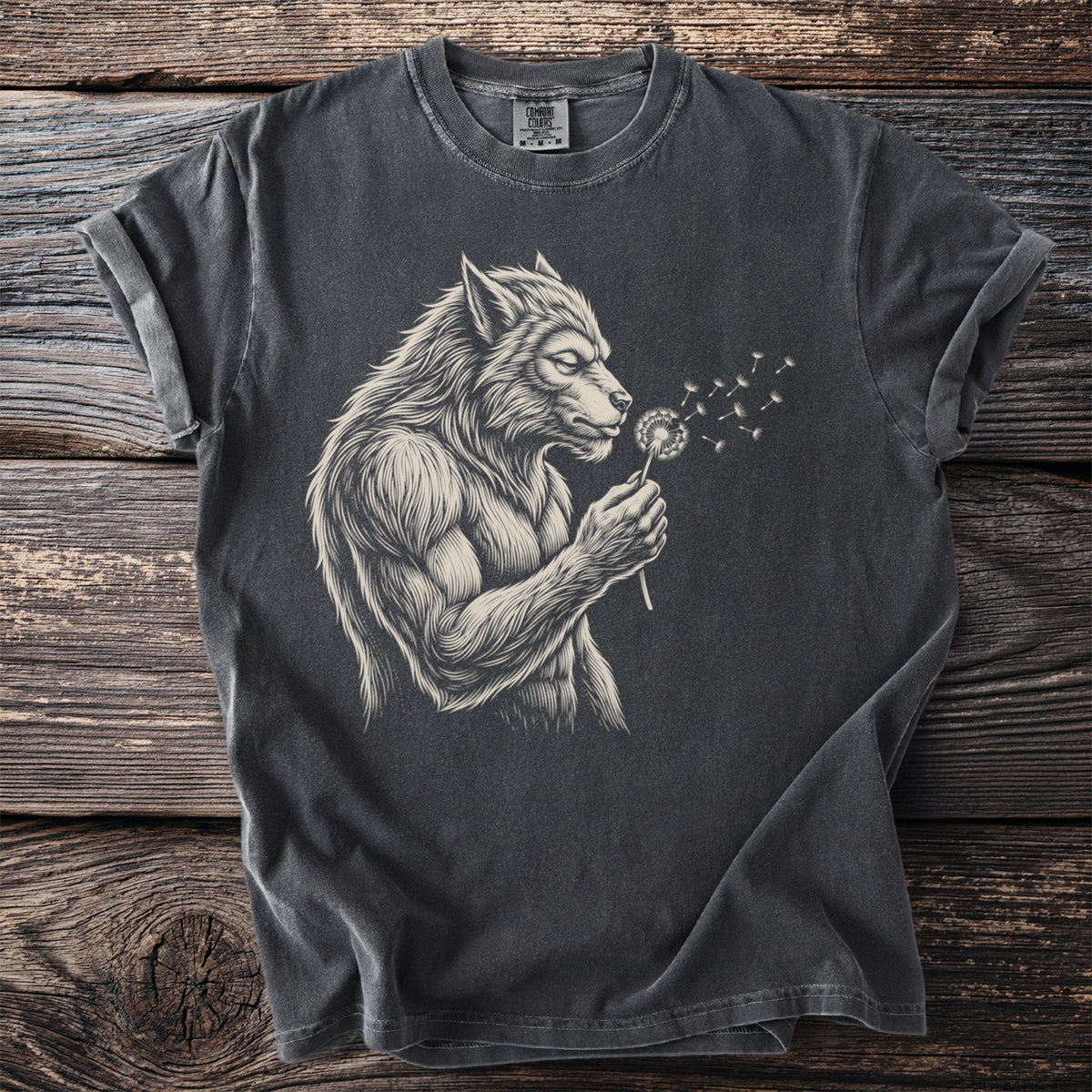 Werewolf blowing on a dandelion on a charcoal grey t-shirt.