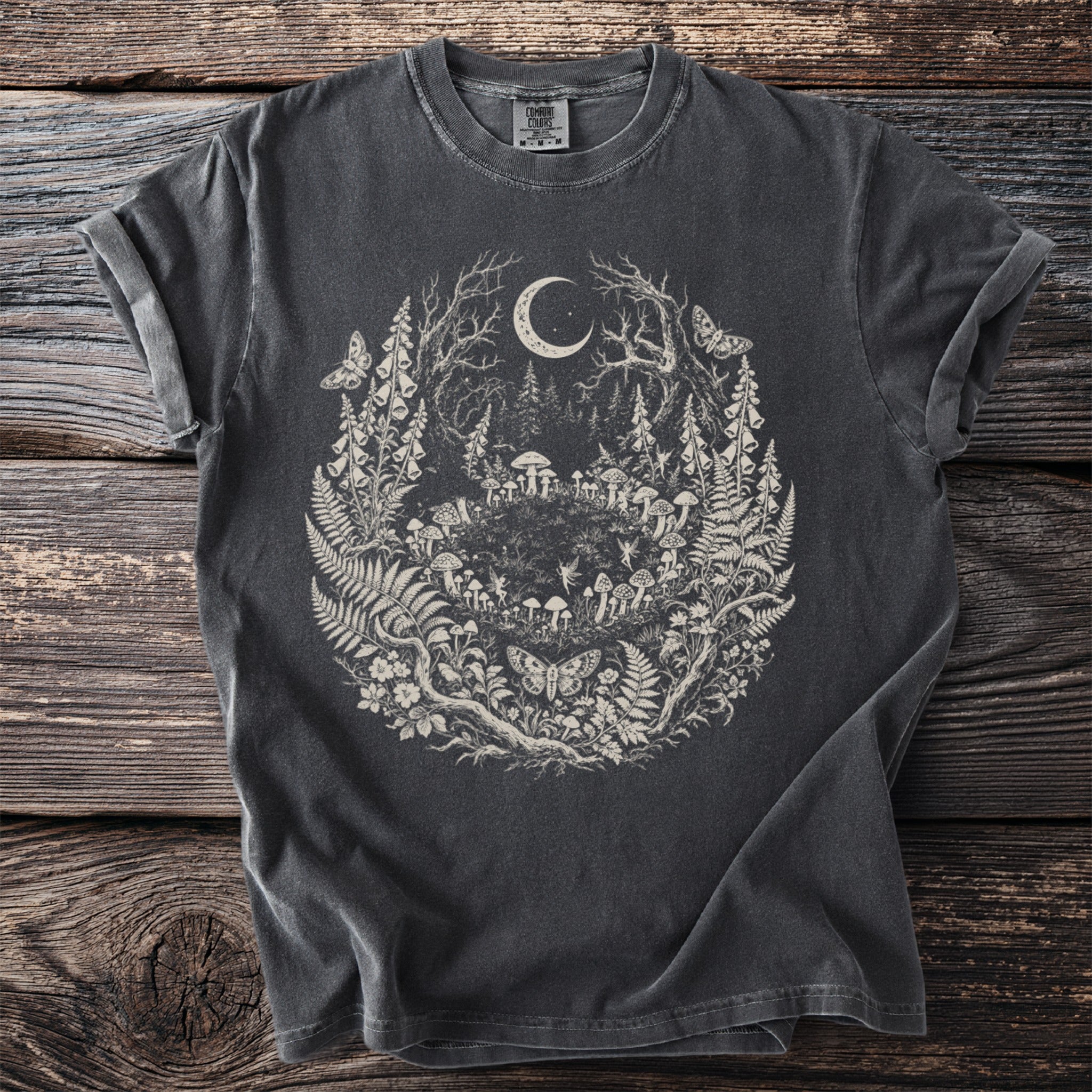 Dark grey t-shirt with a detailed cream circular print of a forest scene with a moon.