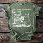 Green t-shirt with 'Local Cryptid Support Group' text and illustration of a raccoon, opossum, cat, bat, and frog.
