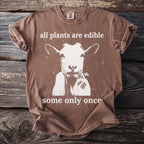 Brown shirt with a white graphic of a goat eating parsley and text.