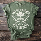 Green t-shirt with white graphic text and design of a moth with skull head.