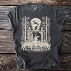 T-shirt graphic with two wolves, a wooden gate, trees, and birds under a moon.
