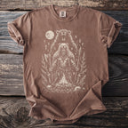Brown t-shirt with a white graphic of a Viking bear warrior beside a campfire.