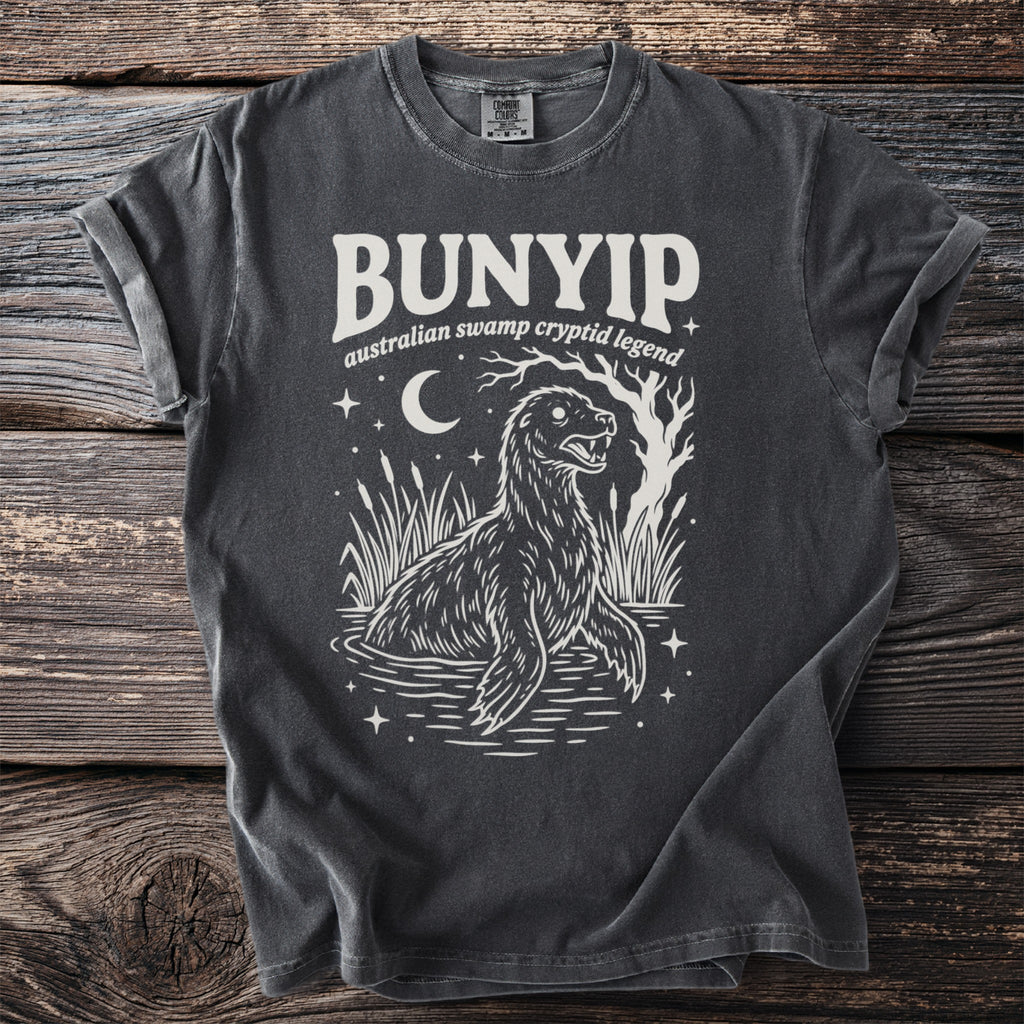 Bunyip Australian swamp cryptid legend graphic on charcoal t-shirt with moon and stars.