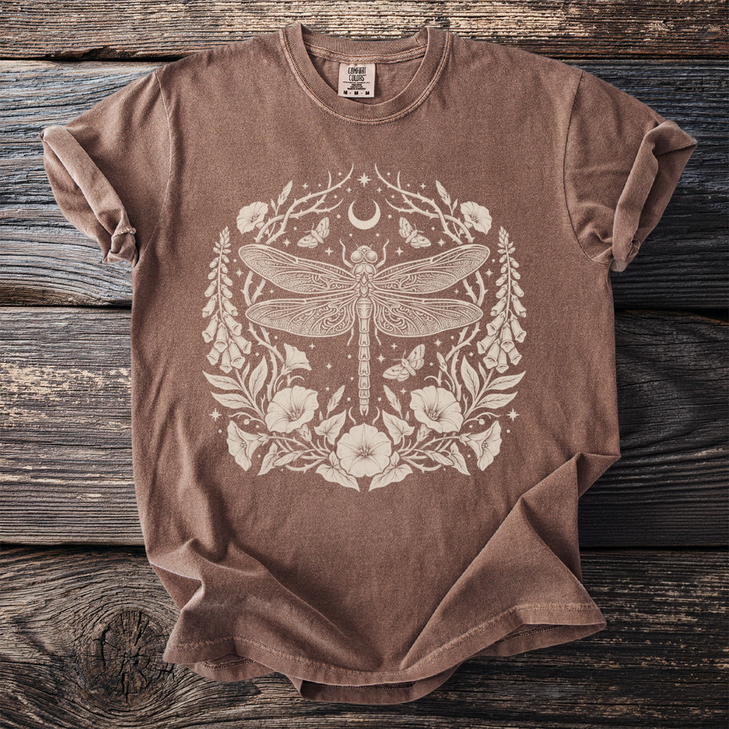 Brown t-shirt with cream colored dragonfly, moon, stars, and floral graphic.