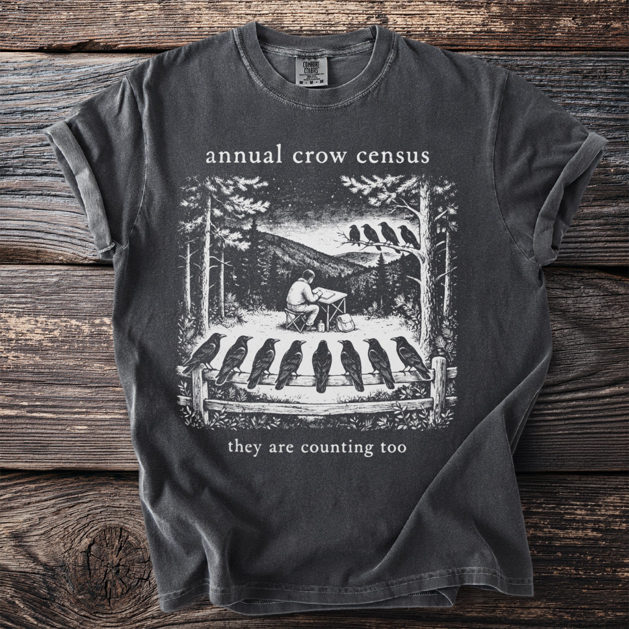 Dark grey t-shirt with black and white drawing: "annual crow census they are counting too".