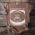 Brown t-shirt with "do not perceive me" and a frog graphic.