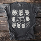 Dark t-shirt with a circular graphic of eight wild cat heads and the text "respect the locals".
