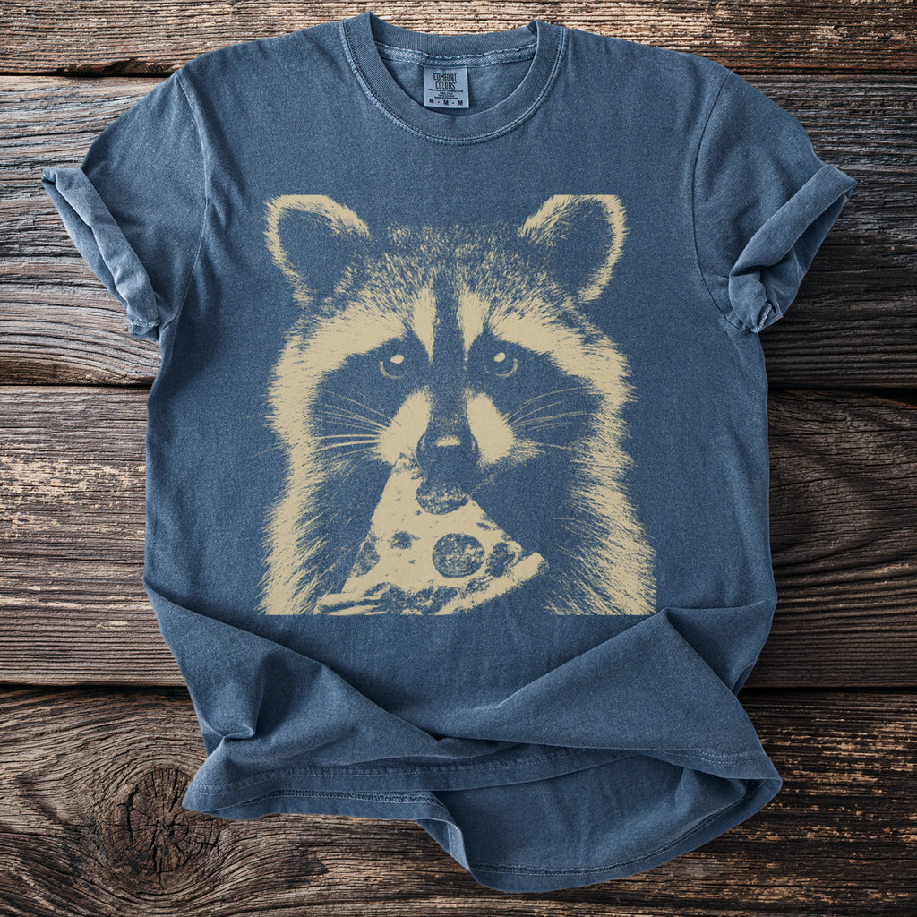 Blue t-shirt with a tan raccoon eating a slice of pizza graphic.