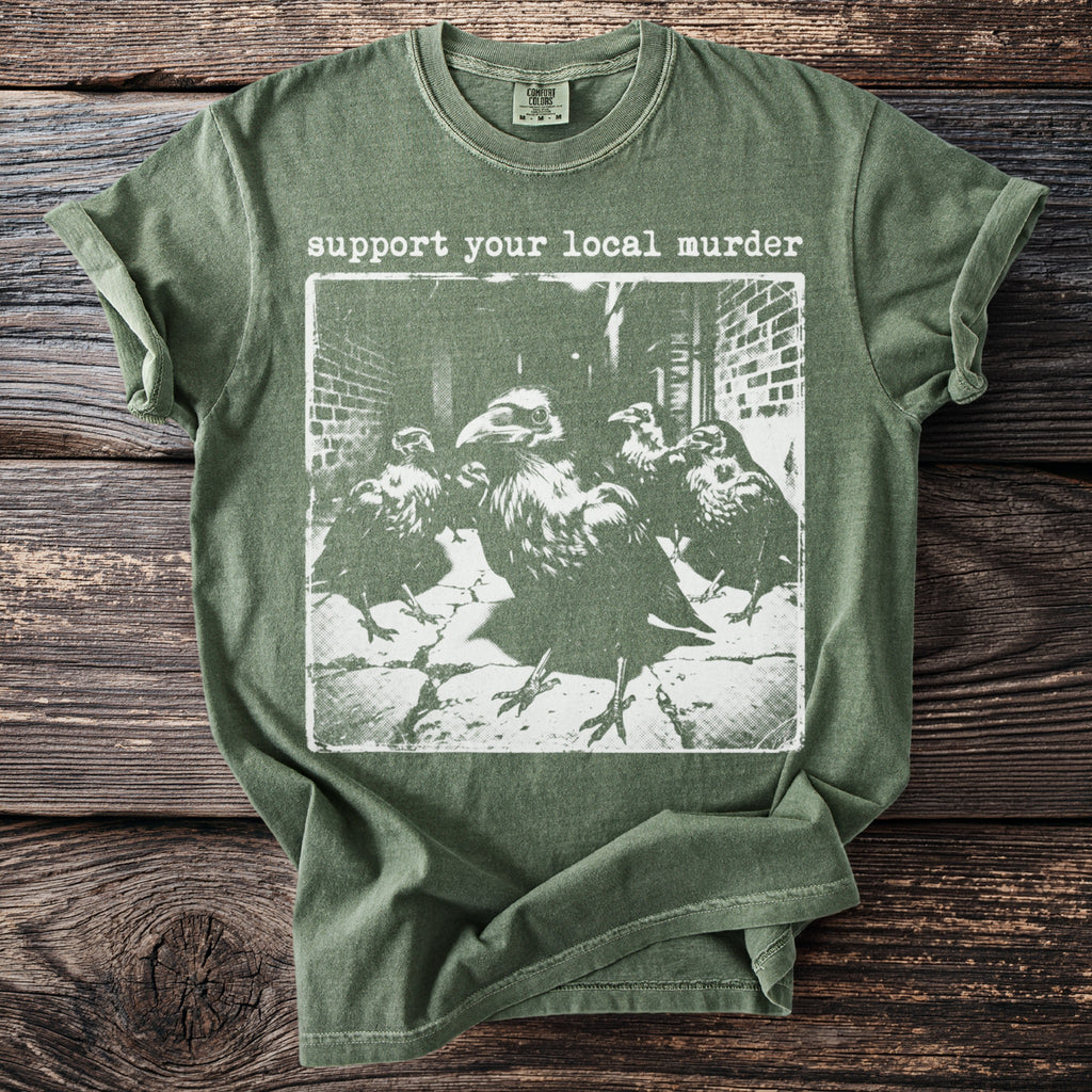 Green t-shirt with "support your local murder" text and a crow graphic.