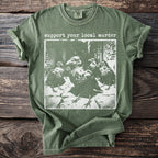 Green t-shirt with "support your local murder" text and a crow graphic.
