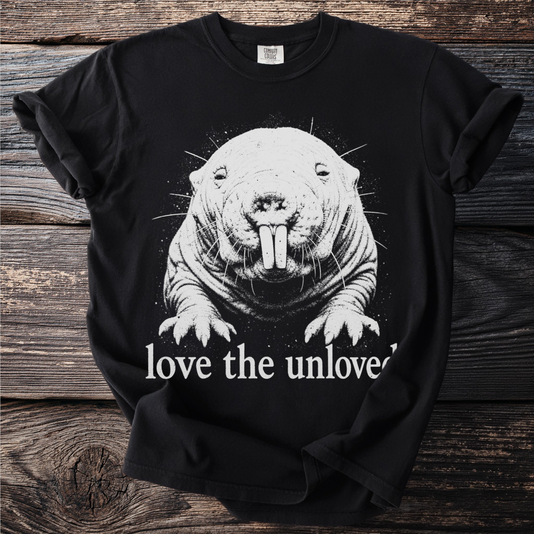 Black t-shirt with a white graphic of a mole-rat and text reading "love the unloved".