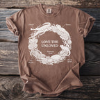 Brown t-shirt with "LOVE THE UNLOVED" and distressed illustrations of animals in a circle.