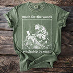 Green t-shirt with graphic of werewolf on laptop and text "made for the woods reachable by email."