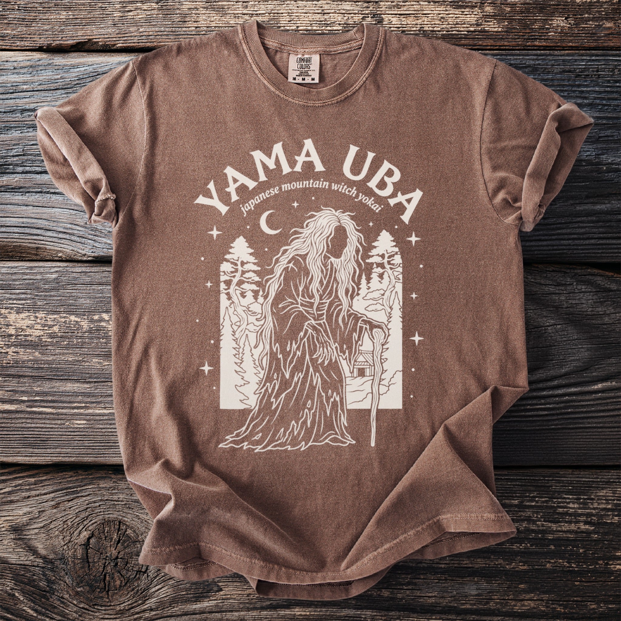 Brown t-shirt with "YAMA UBA japanese mountain witch yokai" graphic.