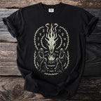 Black t-shirt with an occult-style graphic featuring a skull, fire, hooded figures, and runes.