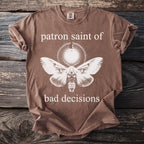 Brown t-shirt with moth design and text "patron saint of bad decisions".