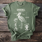 Green t-shirt with a shoebill illustration and anatomical details labeled.