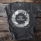 Dark grey t-shirt with "Love The Unloved" text and illustrated sea creatures.