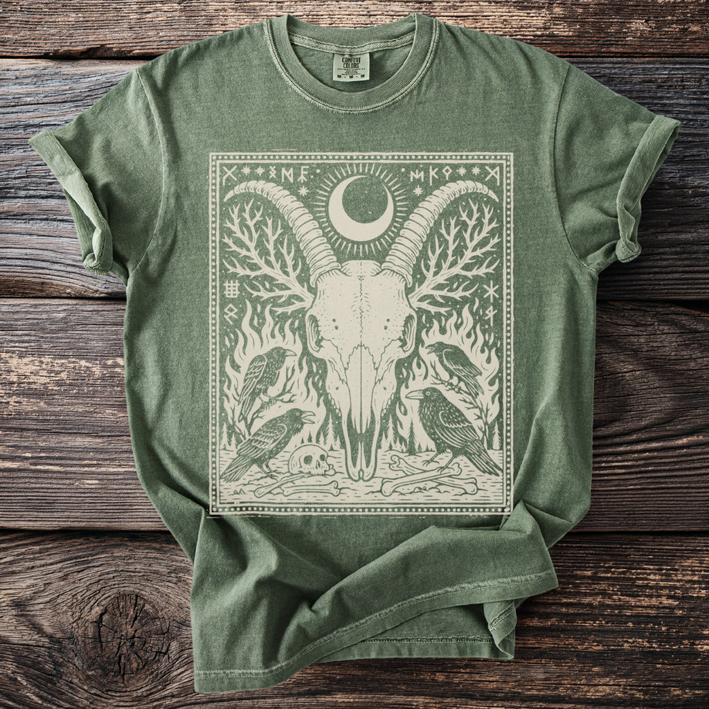 Green t-shirt with a detailed graphic of a goat skull, moon, crows, and runes.
