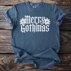 Blue t-shirt with white "Merry Gothmas" text, skulls, and poinsettias.