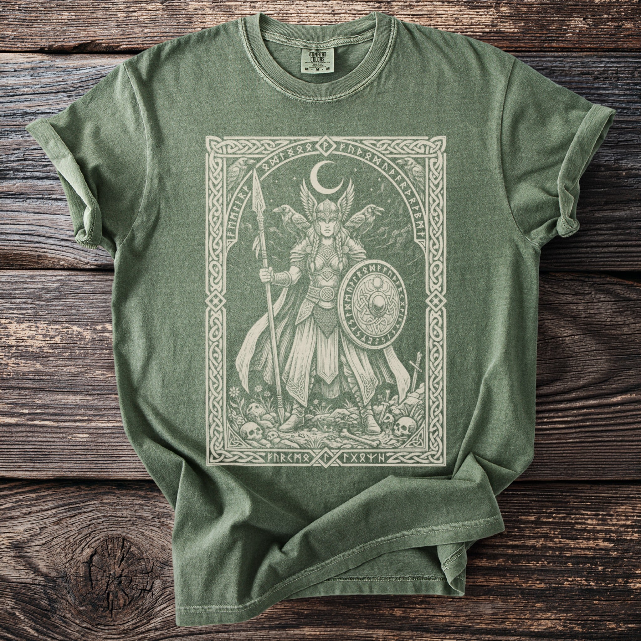 Green t-shirt with a detailed illustration of a Norse warrior and runes.