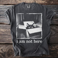Black cat in box graphic t-shirt with "i am not here" text.