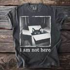 Black cat in box graphic t-shirt with "i am not here" text.