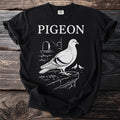Black t-shirt with white graphic of a pigeon and two smaller pigeons, with the word PIGEON.