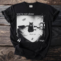 Black t-shirt with a bed, black cat, spider, moth, and beetle graphic with text.