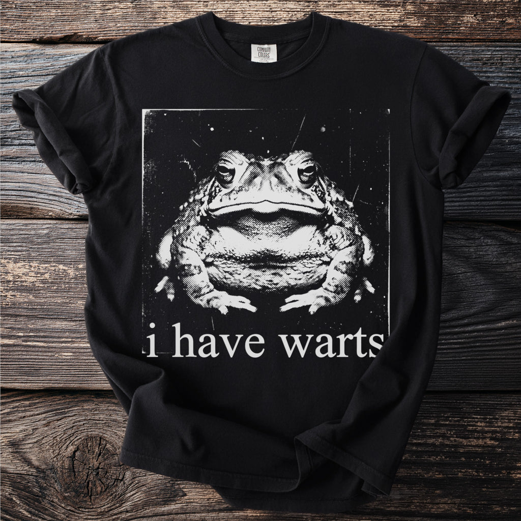 Black t-shirt with a close-up vintage-style graphic of a toad and text "i have warts."