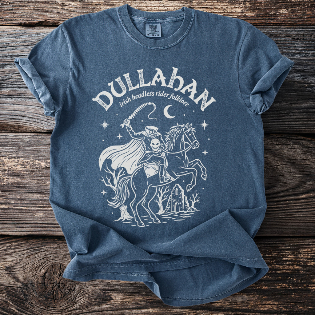 Blue t-shirt with a white graphic of the Dullahan, an Irish headless rider, on a horse.