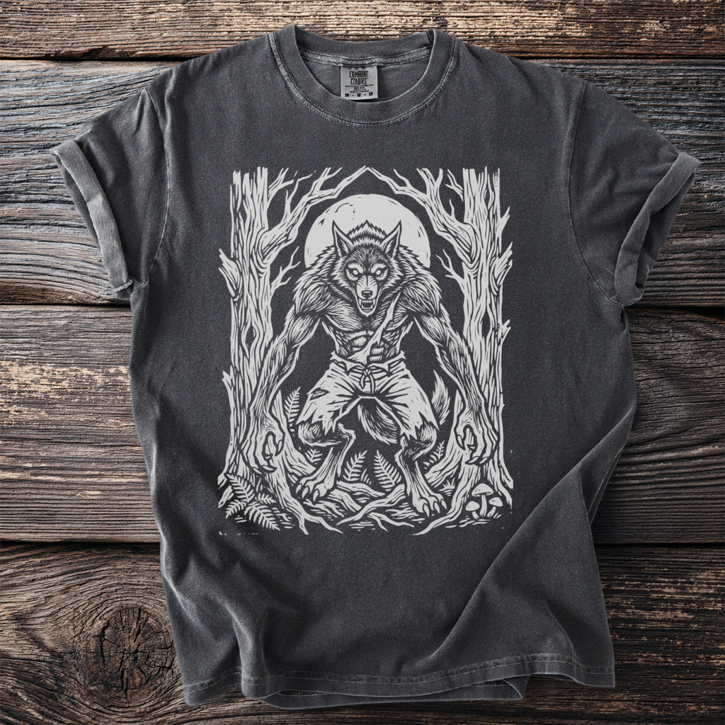 Werewolf graphic on a charcoal t-shirt with trees and a full moon.