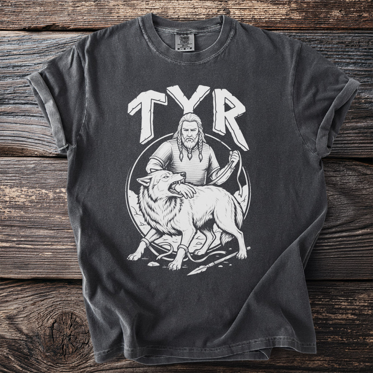 Dark t-shirt with white graphic of Tyr and Fenrir wolf bound by chains.