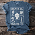Blue t-shirt with "All Plants Are Edible" and a skull surrounded by toxic plants.