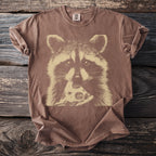 Brown t-shirt with a graphic of a raccoon eating pizza.