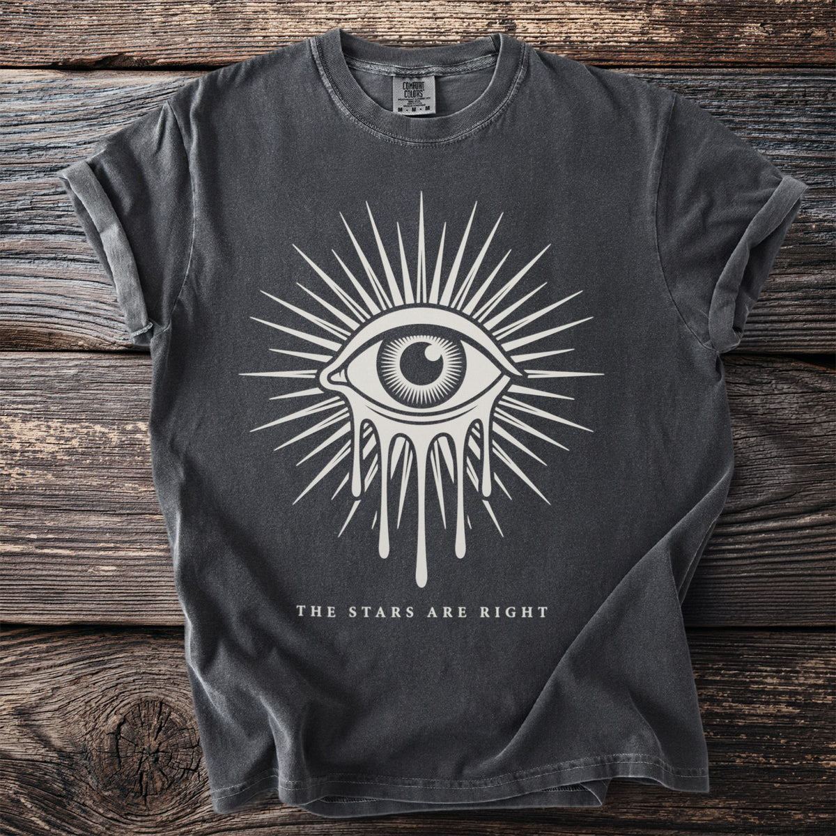 Charcoal t-shirt with dripping eye graphic and text "THE STARS ARE RIGHT".