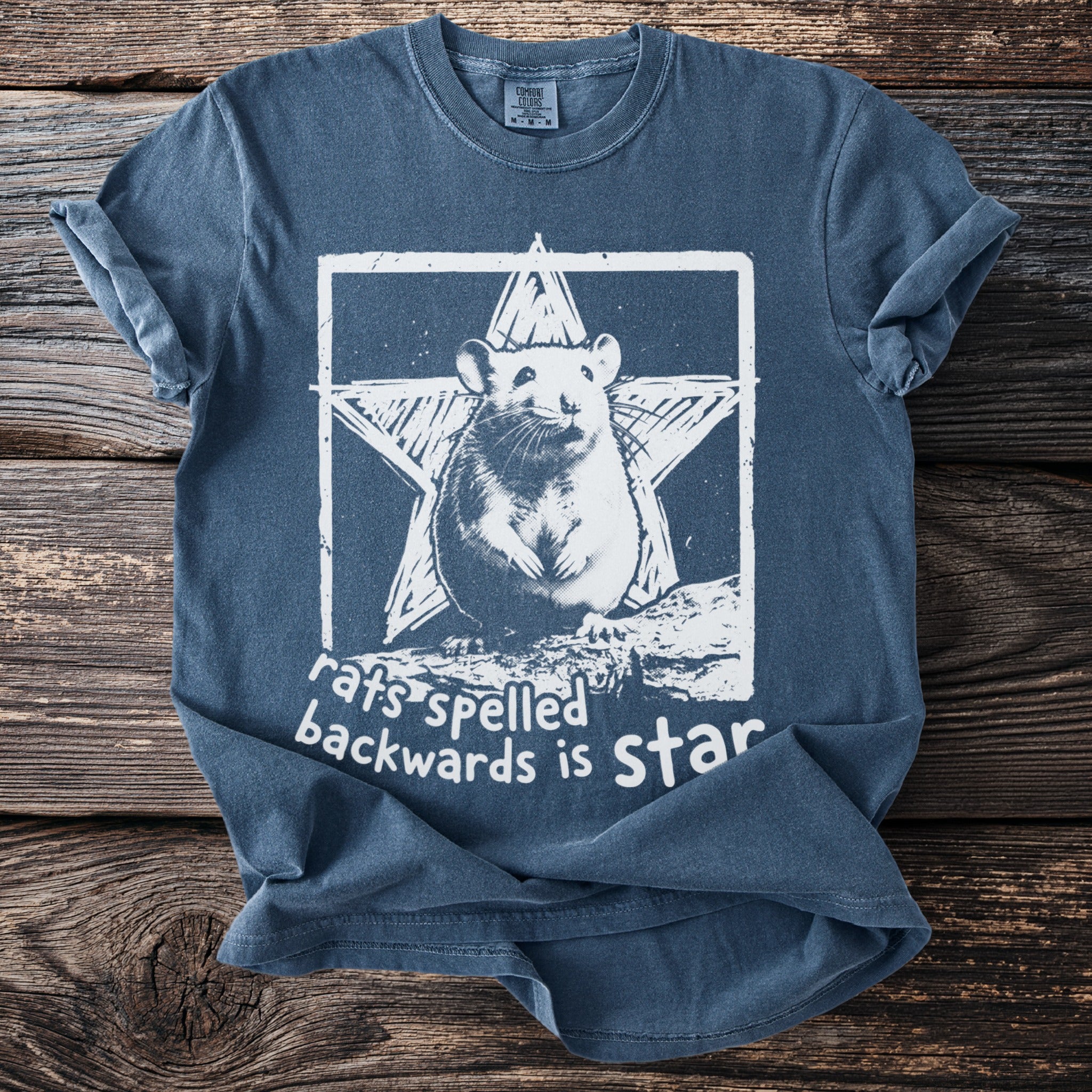 Blue t-shirt with a rat and star graphic and text "rats spelled backwards is star".