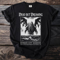 Black t-shirt with "Dead But Dreaming" graphic of a tentacled creature and a ship.